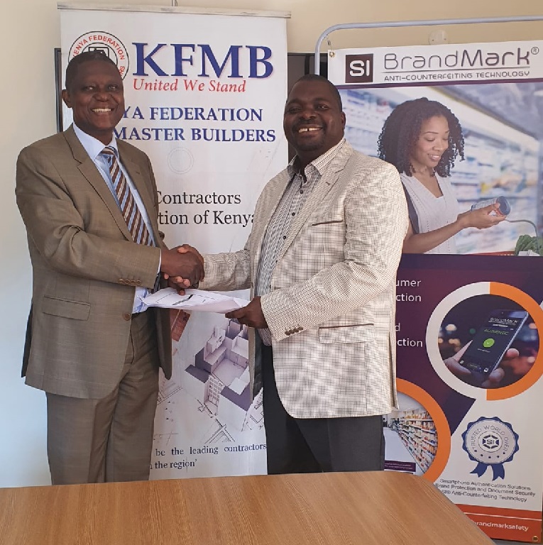 Chairman signing an agreement with Brandmark